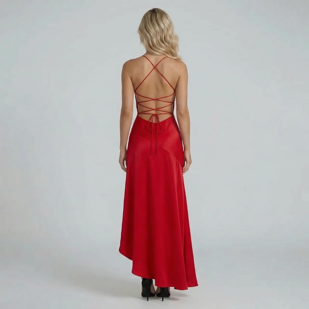 Red lace-up back maxi dress with ruffled hem — back view emphasizing the open-back detail and adjustable tie straps.