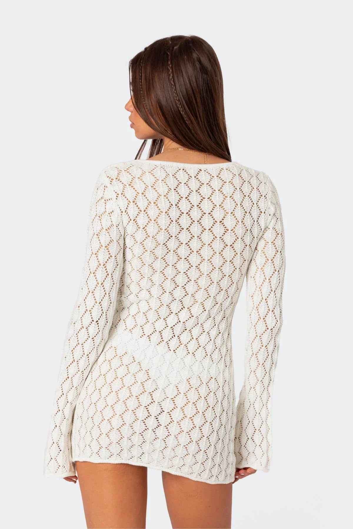 White crochet mini dress with breathable open crochet design — back view.