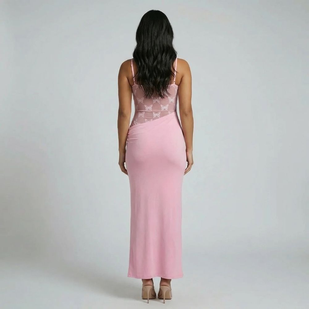 Pink lace corset maxi dress — back view showing lace panel and curve-skimming fit.