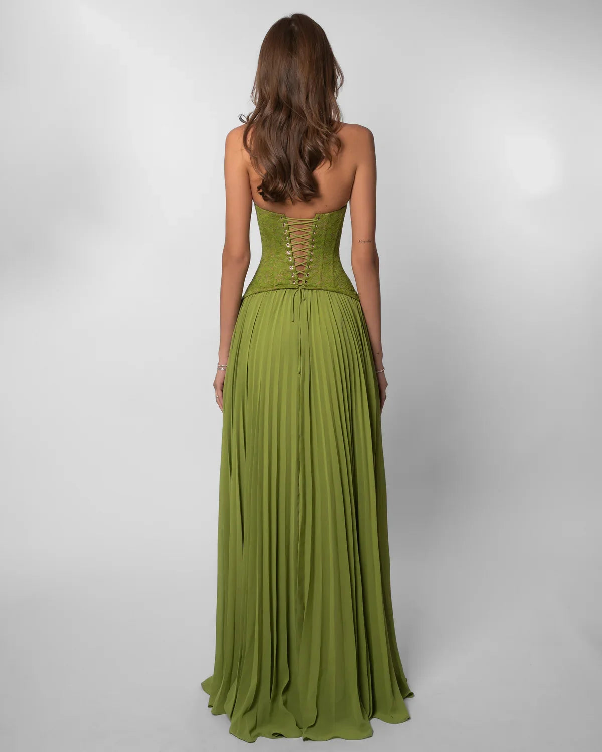 Women green lace corset maxi dress with sweetheart halter neckline and pleated floor length skirt