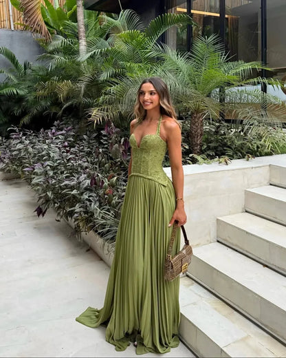 Women green lace corset maxi dress with sweetheart halter neckline and pleated floor length skirt