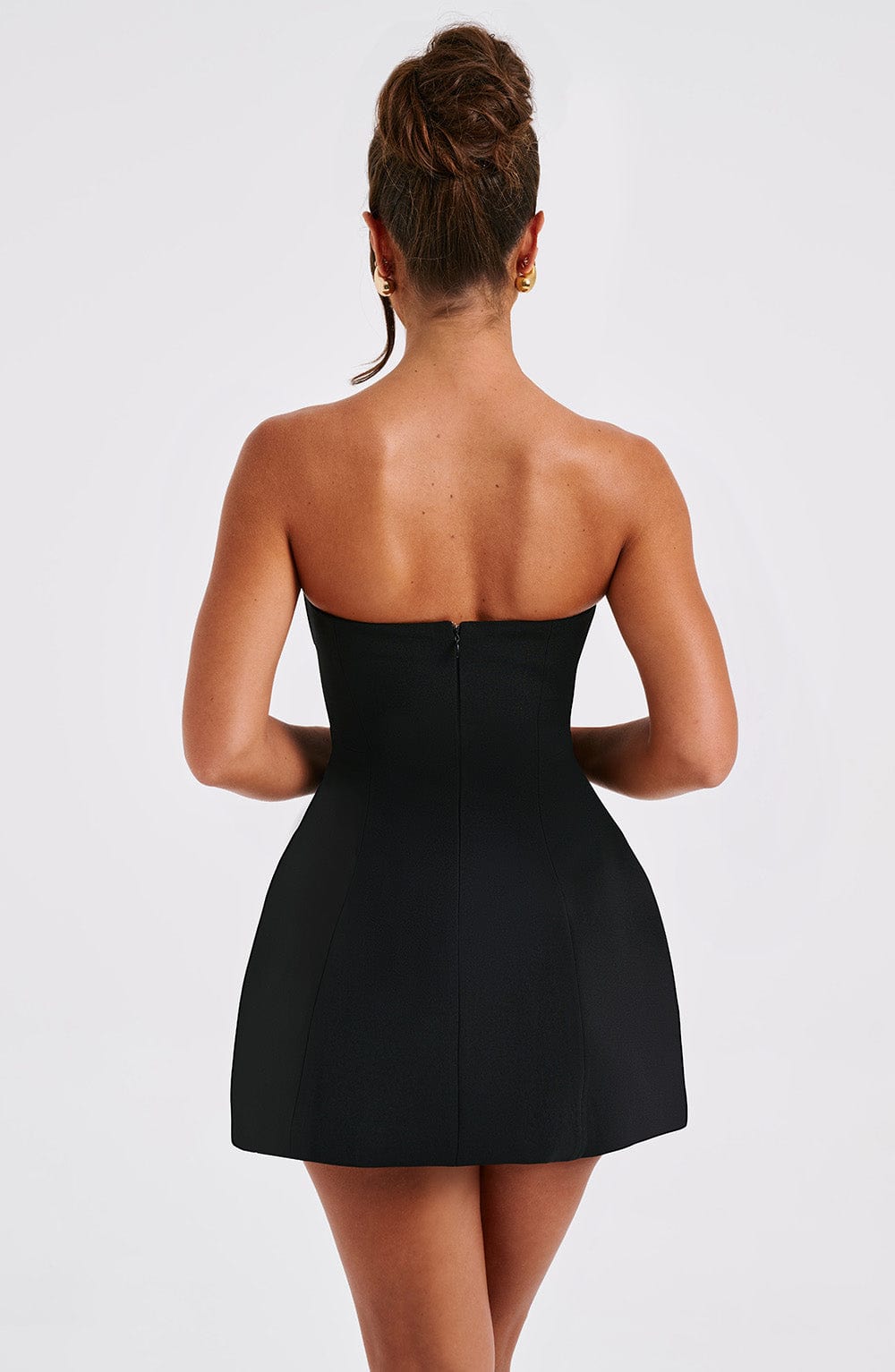 Women black strapless mini dress, back view