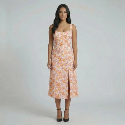 Orange floral jacquard midi dress with a front slit — front view showcasing bustier bodice and square neckline.