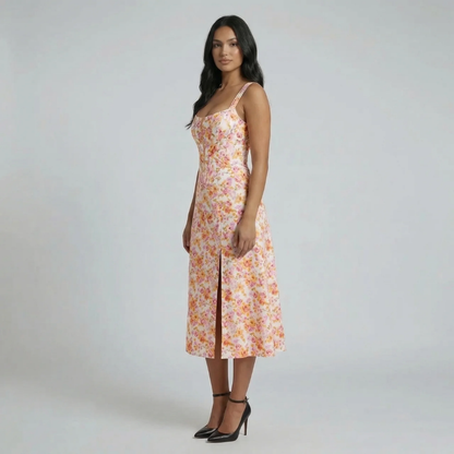 Orange floral jacquard midi dress — side view showing the elegant slit and flattering fit.