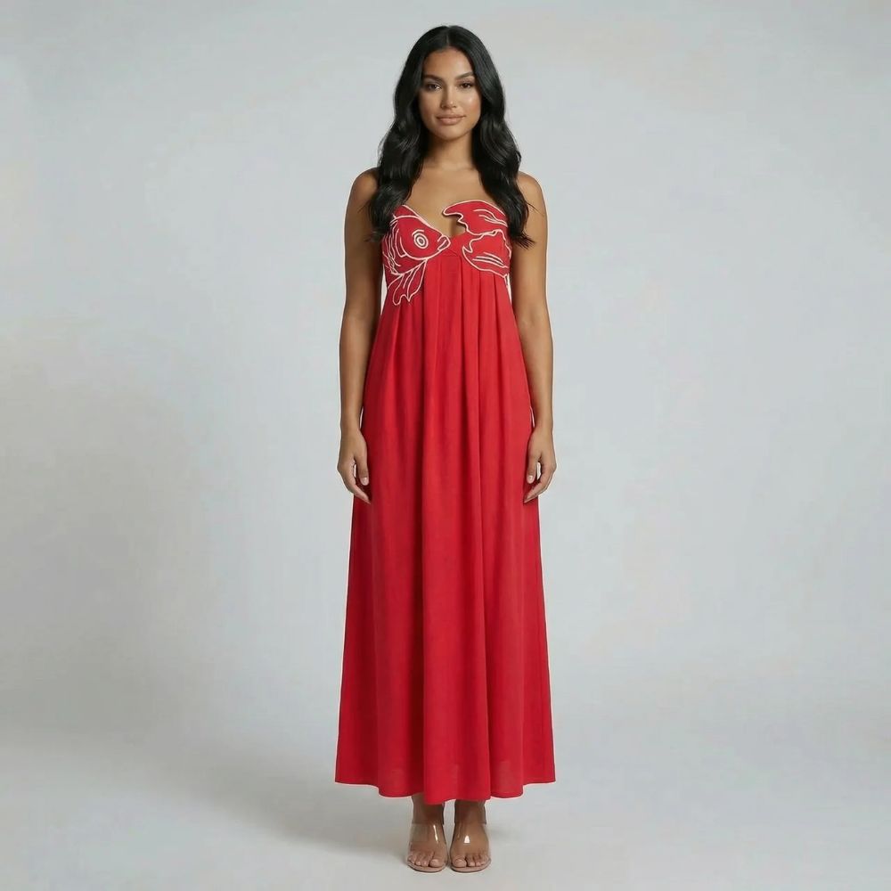Red graphic maxi dress with sweetheart neckline and spaghetti straps, front view.