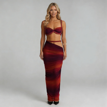 Cream ruched maxi skirt close-up — flowing texture and draped design detail.