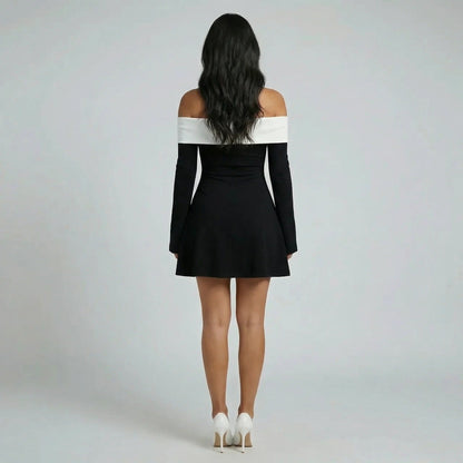 Black off-shoulder A-line mini dress — back view showing skirt and bell sleeve movement.