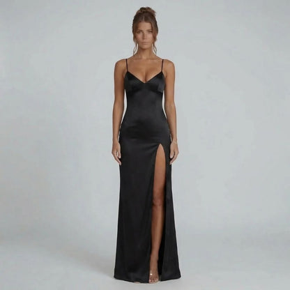 Black lace-up maxi dress with thigh slit — front view showing the flowing maxi length and elegant bias-cut fit.