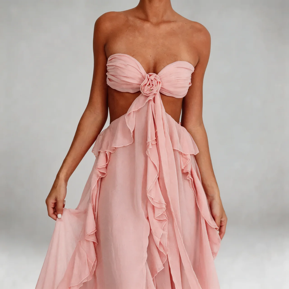 Close-up of blush pink maxi dress — detailing the rosette at the bust and ruffle trim.
