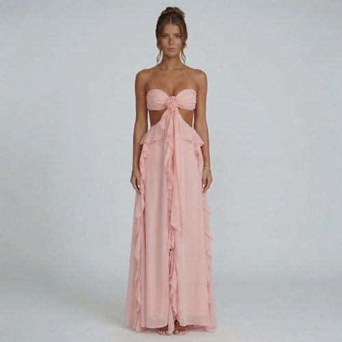 Strapless blush pink maxi dress with chiffon ruffles — front view showing rosette detail.