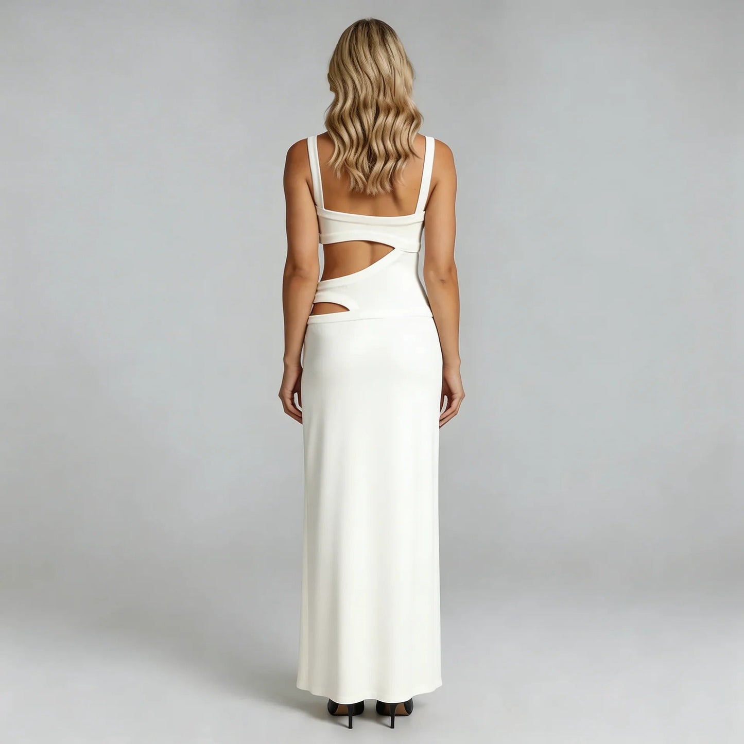 White cutout maxi dress showing waist cutout details and open back — full back view.