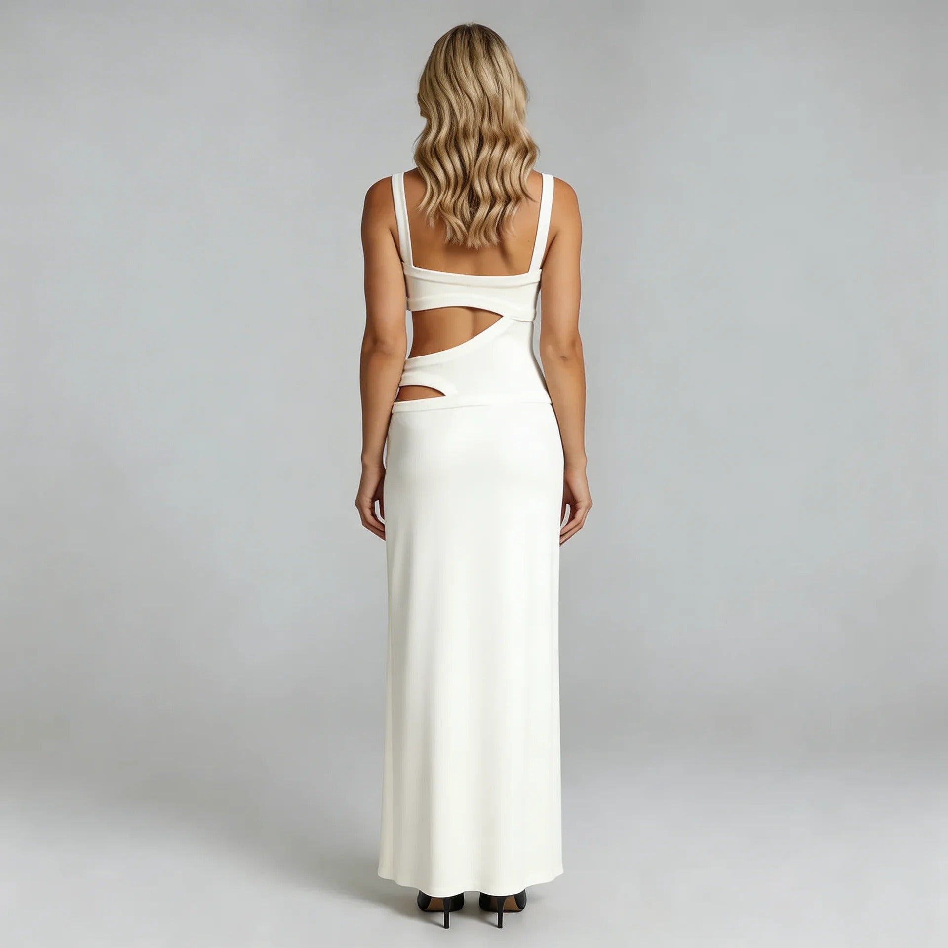 White cutout maxi dress showing waist cutout details and open back — full back view.