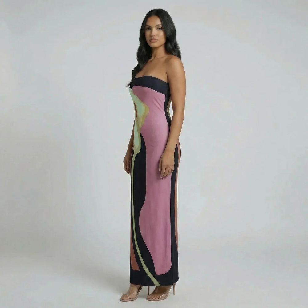 Side view of pink strapless abstract maxi dress — sleek column fit and maxi-length hem.