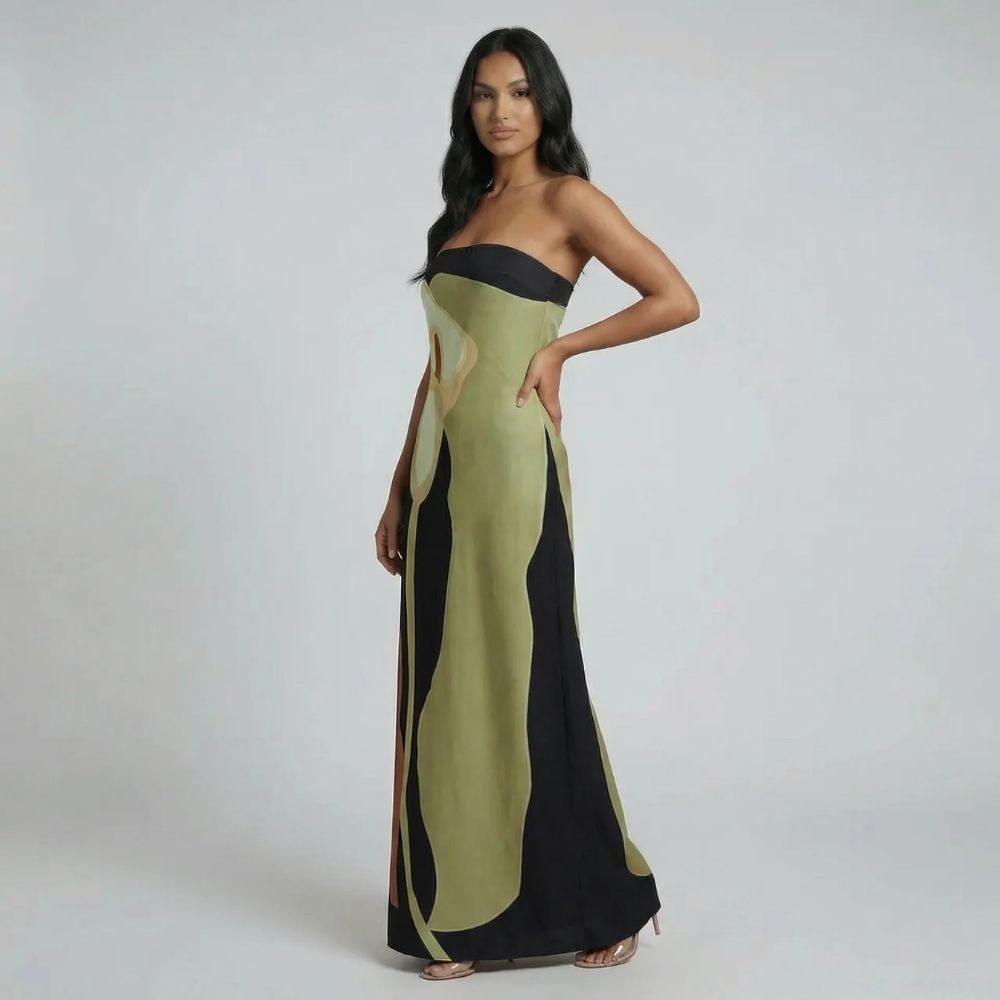 Green strapless abstract maxi dress — model angled showing abstract print and bandeau neckline.