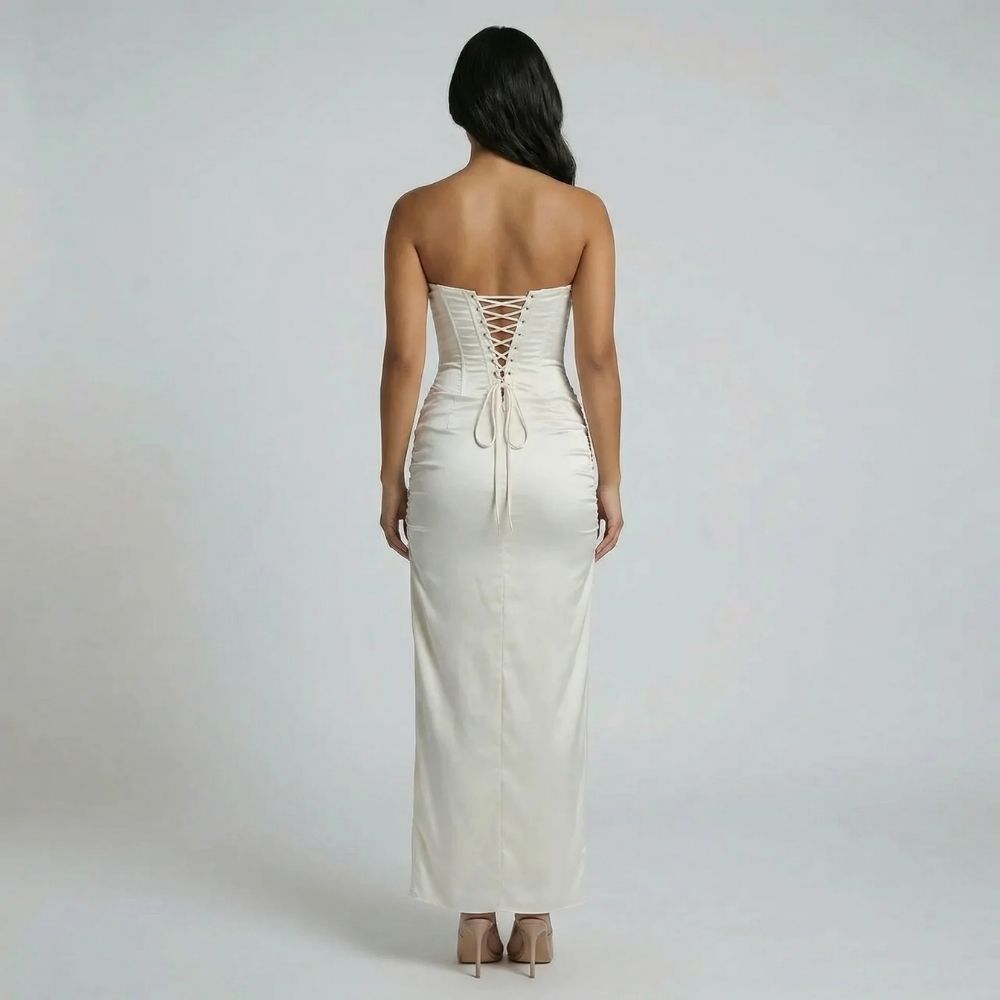 Ivory corset maxi dress with lace-up back — back view displaying adjustable ties and fitted bodice