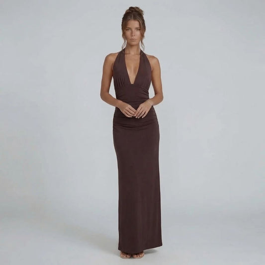 Brown ruched maxi dress with halter neckline — front view highlighting plunging neckline and flowing skirt