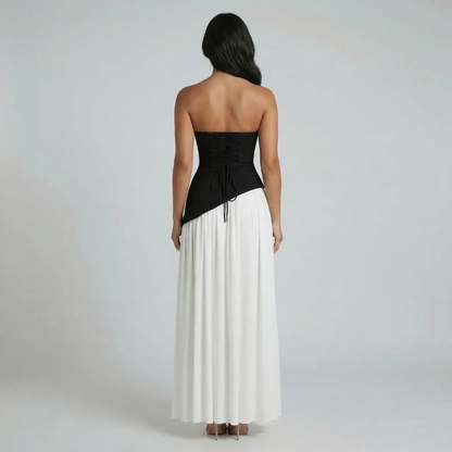 Black strapless maxi dress with lace-up back and flowing skirt — back view