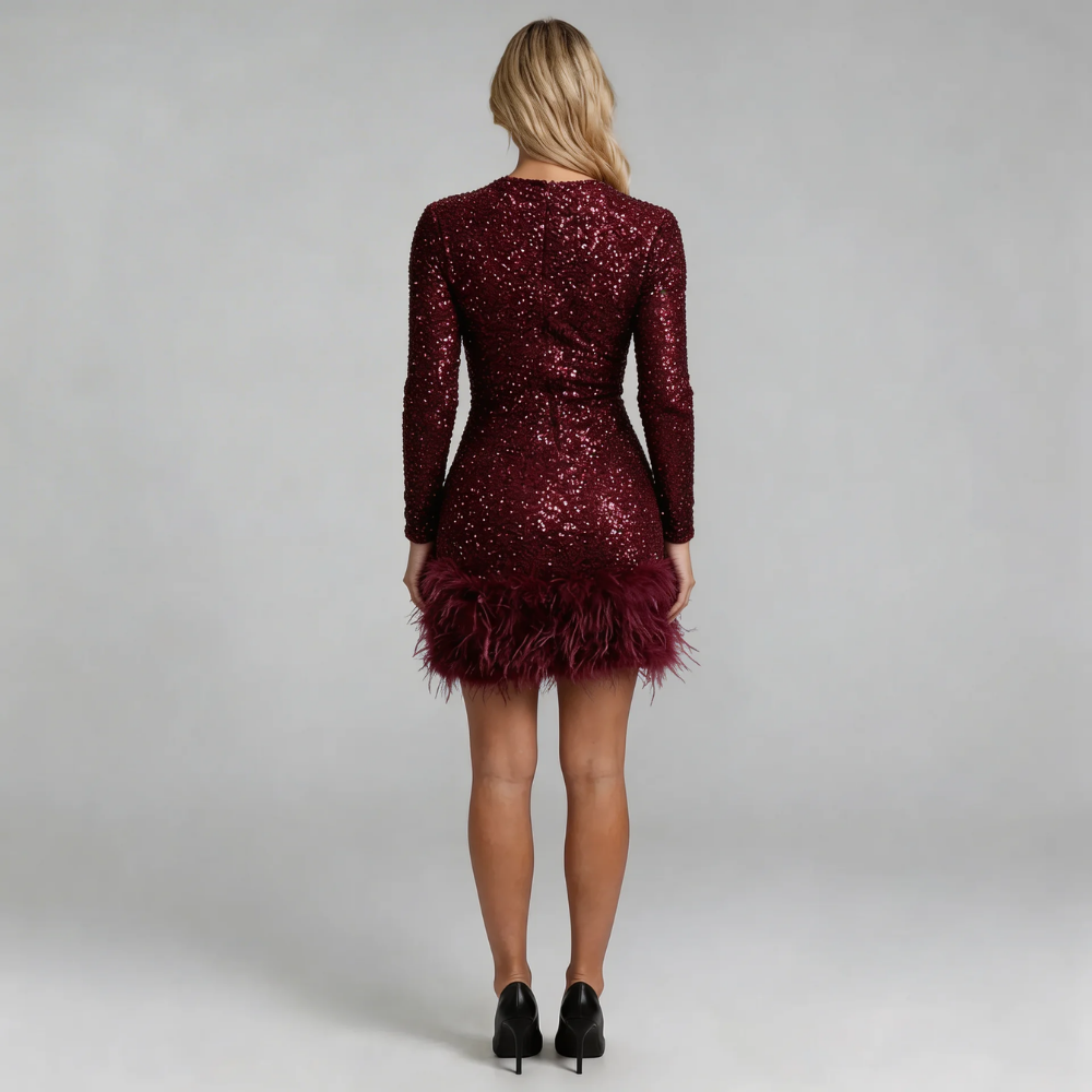 Burgundy sequin mini dress with feather-trim hemline — back view highlighting curve-skimming fit and polished finish.