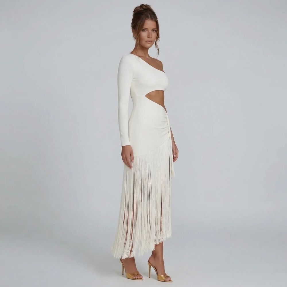 White fringe midi dress — side angle showing flowing fringe hemline and sculpted silhouette.