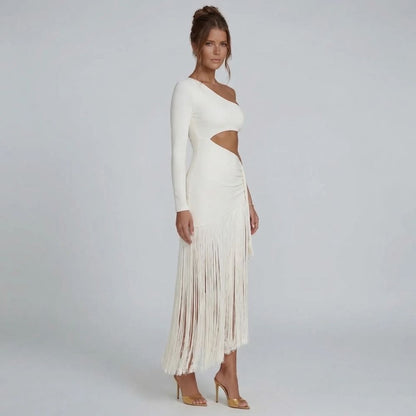 White fringe midi dress — side angle showing flowing fringe hemline and sculpted silhouette.