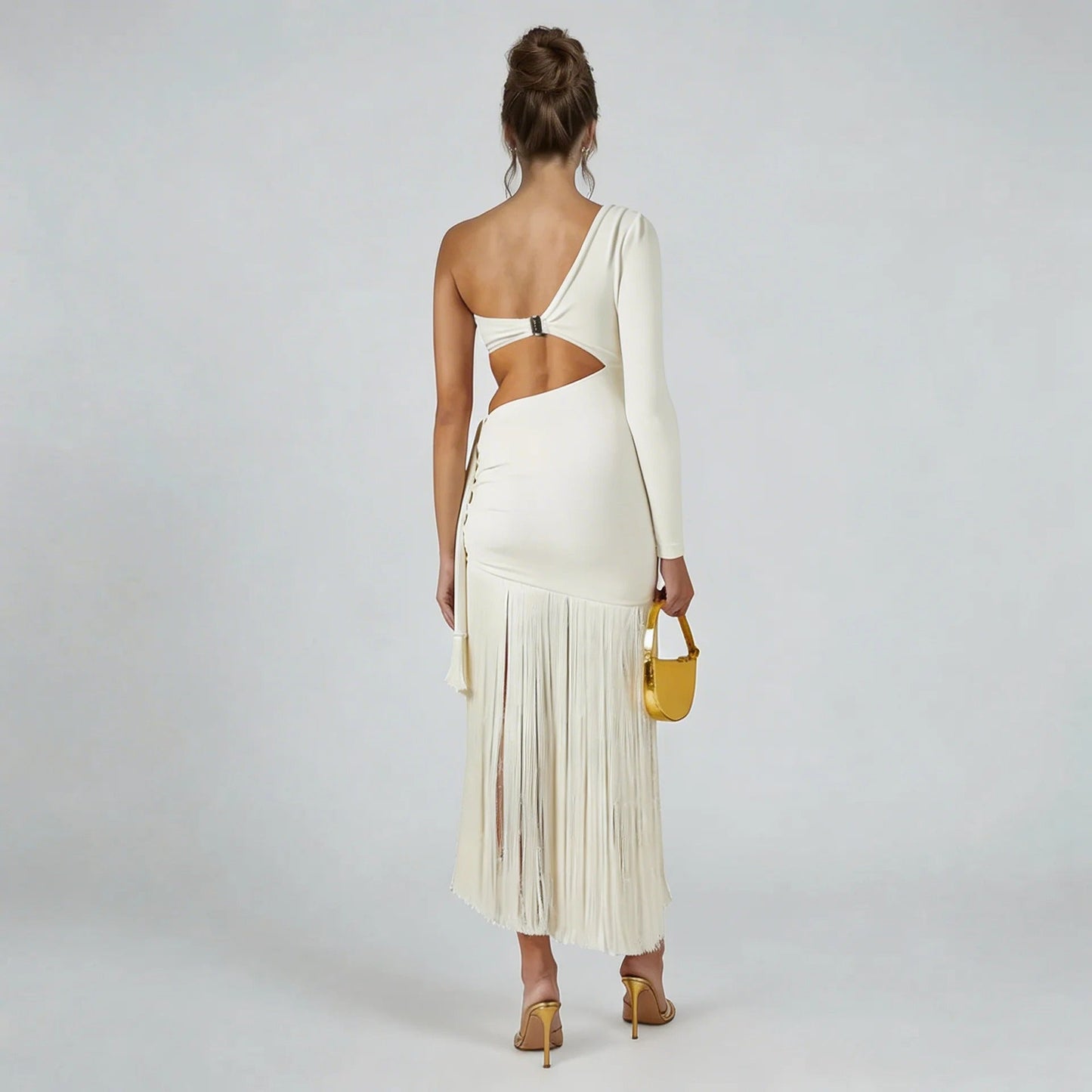 White fringe midi dress — back view highlighting open-back clasp and asymmetrical design.