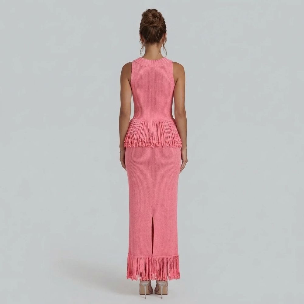 Back view of pink fringe maxi dress — featuring a sleek back slit and fitted silhouette.