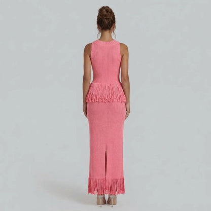 Back view of pink fringe maxi dress — featuring a sleek back slit and fitted silhouette.