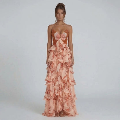 Peach tiered ruffle maxi dress with beaded butterfly bodice — front view showcasing deep V neckline.