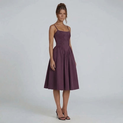 Purple lace fit-and-flare midi dress — side view showcasing delicate straps and sculpted bodice.