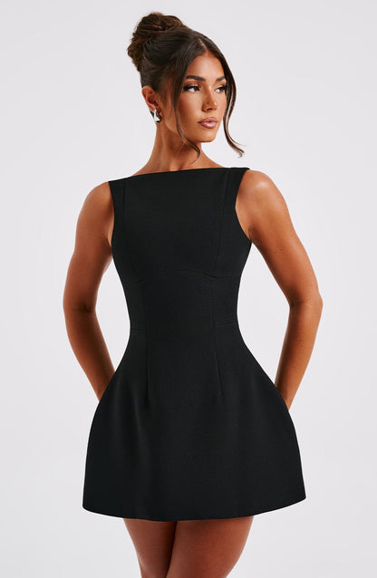 Women black scoop mini dress, back view