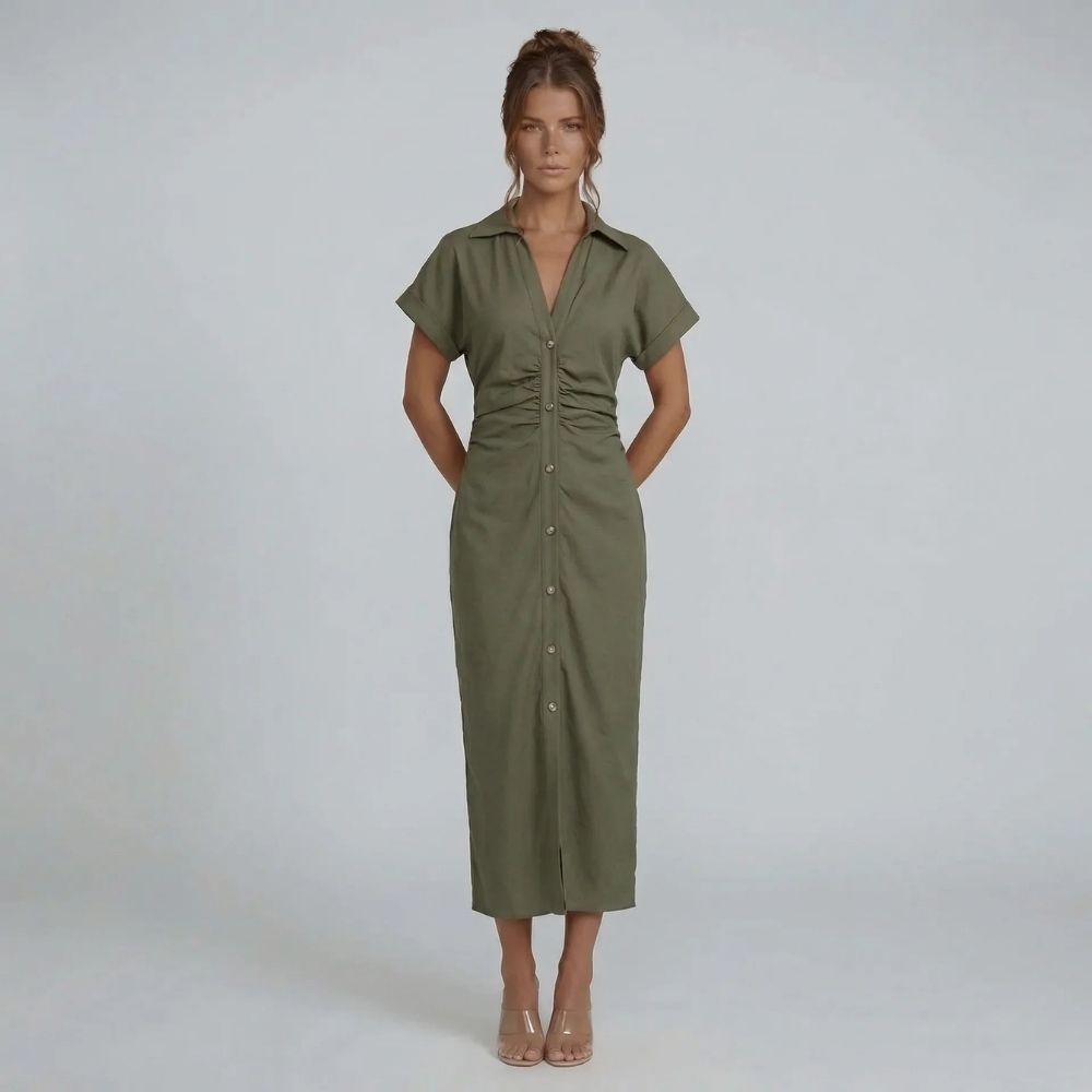 Green button-down midi dress styled with nude heels, cinched waist visible from front.