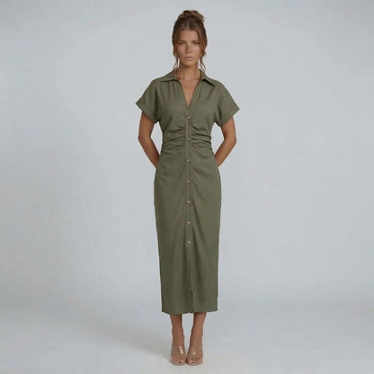 Green button-down midi dress styled with nude heels, cinched waist visible from front.