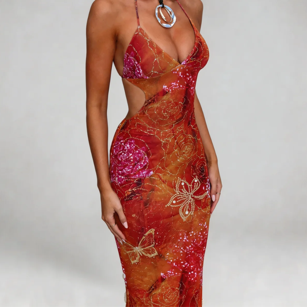 Red floral print maxi dress with halter style — close-up showing vibrant sunset tones and intricate floral details.