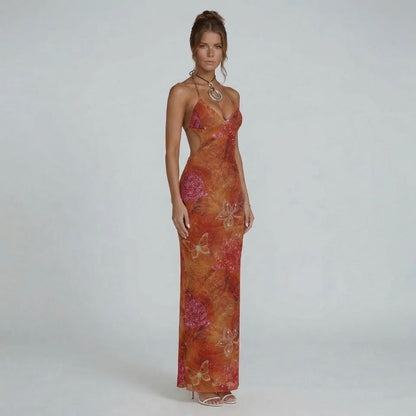 Red floral halter neckline maxi dress with side cutouts — front view showcasing plunging neckline and sculpted fit.
