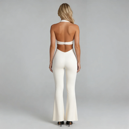 White halter jumpsuit with open-back cutout and flared legs — back view highlighting modern design.