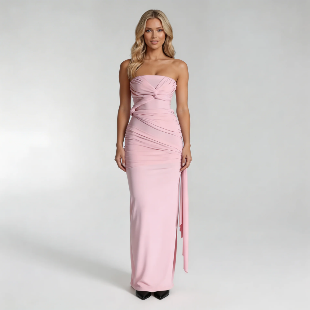 Blush ruched strapless maxi dress — front view with twist bust detail and slit design