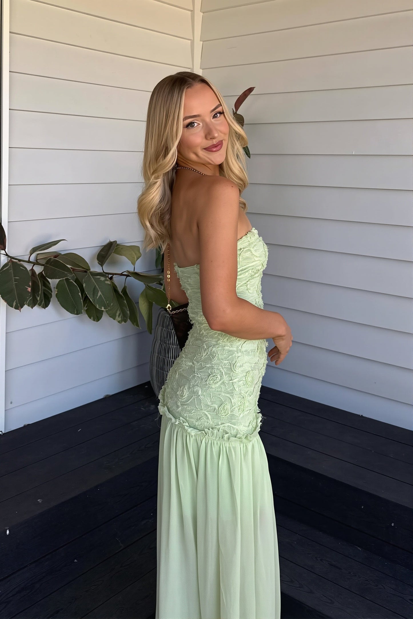 Women green strapless floral maxi dress, side view