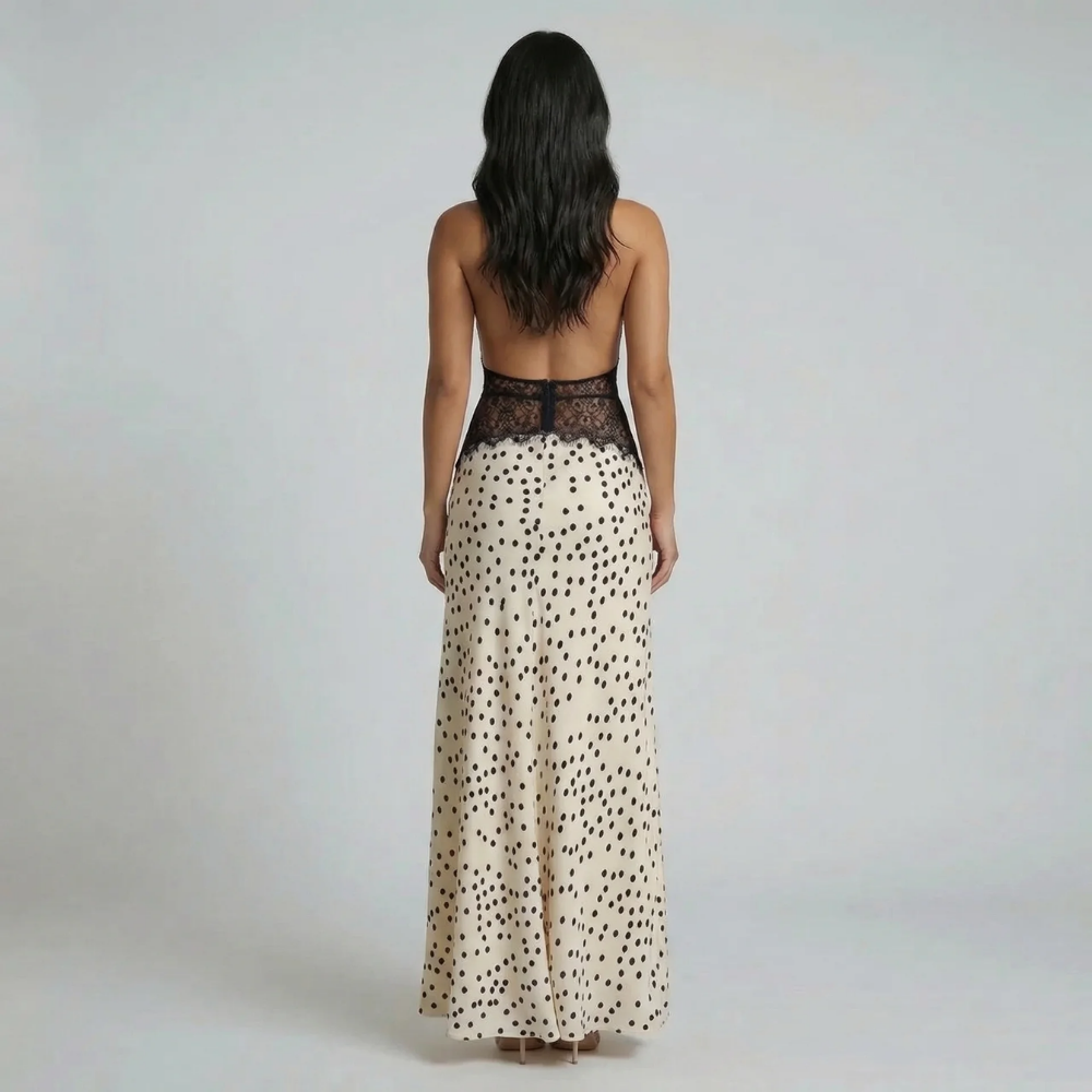 Beige polka-dot halter maxi dress — back view showing the open back design and floor-length skirt details.