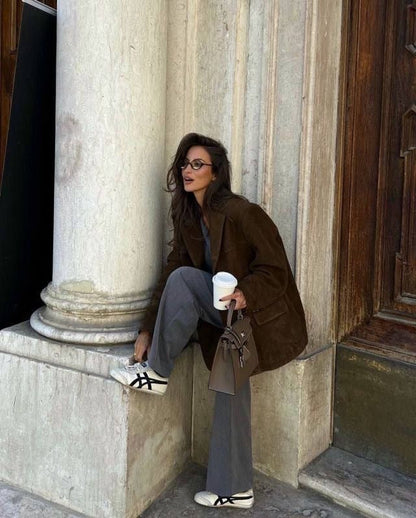 Women brown notched lapel button solid blazer, side view