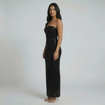 Black sequin strapless maxi dress — side view showing body-hugging silhouette and shimmering finish