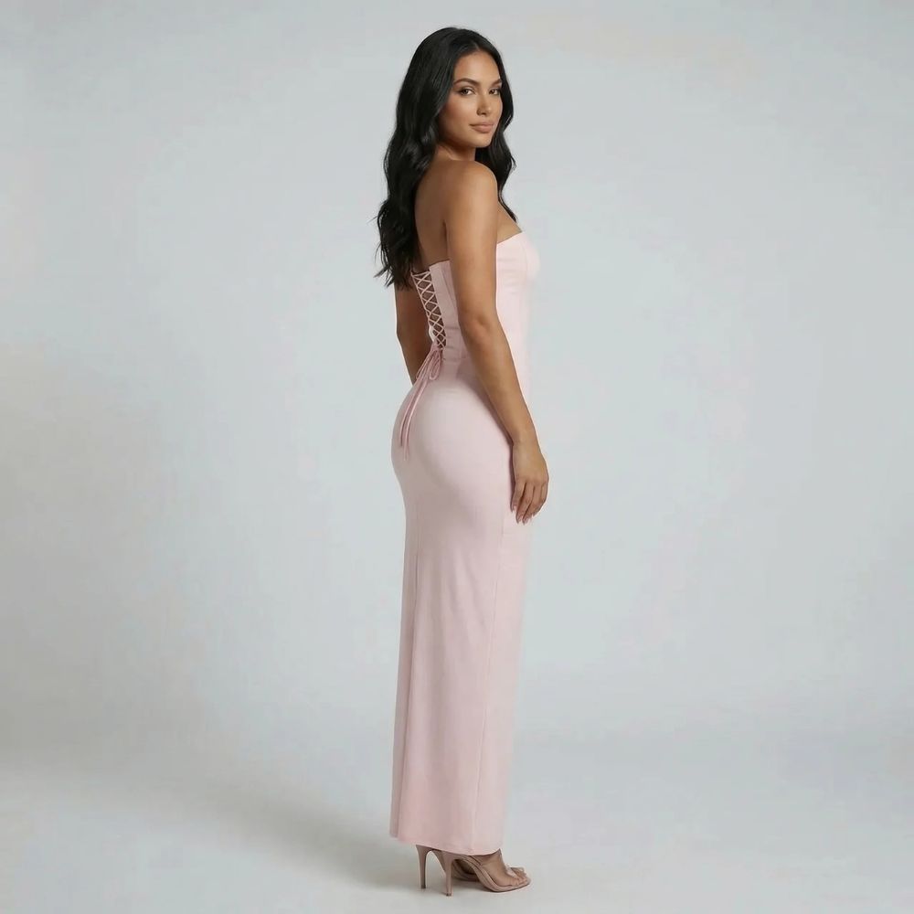 Pink strapless maxi dress — back view showing lace-up closure