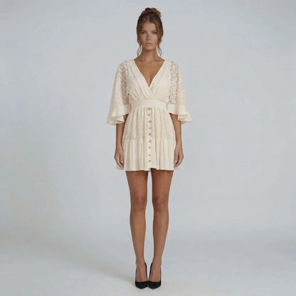 Ivory lace mini dress with flutter sleeves and button-down front — front view showing deep V-neckline and smocked waist.