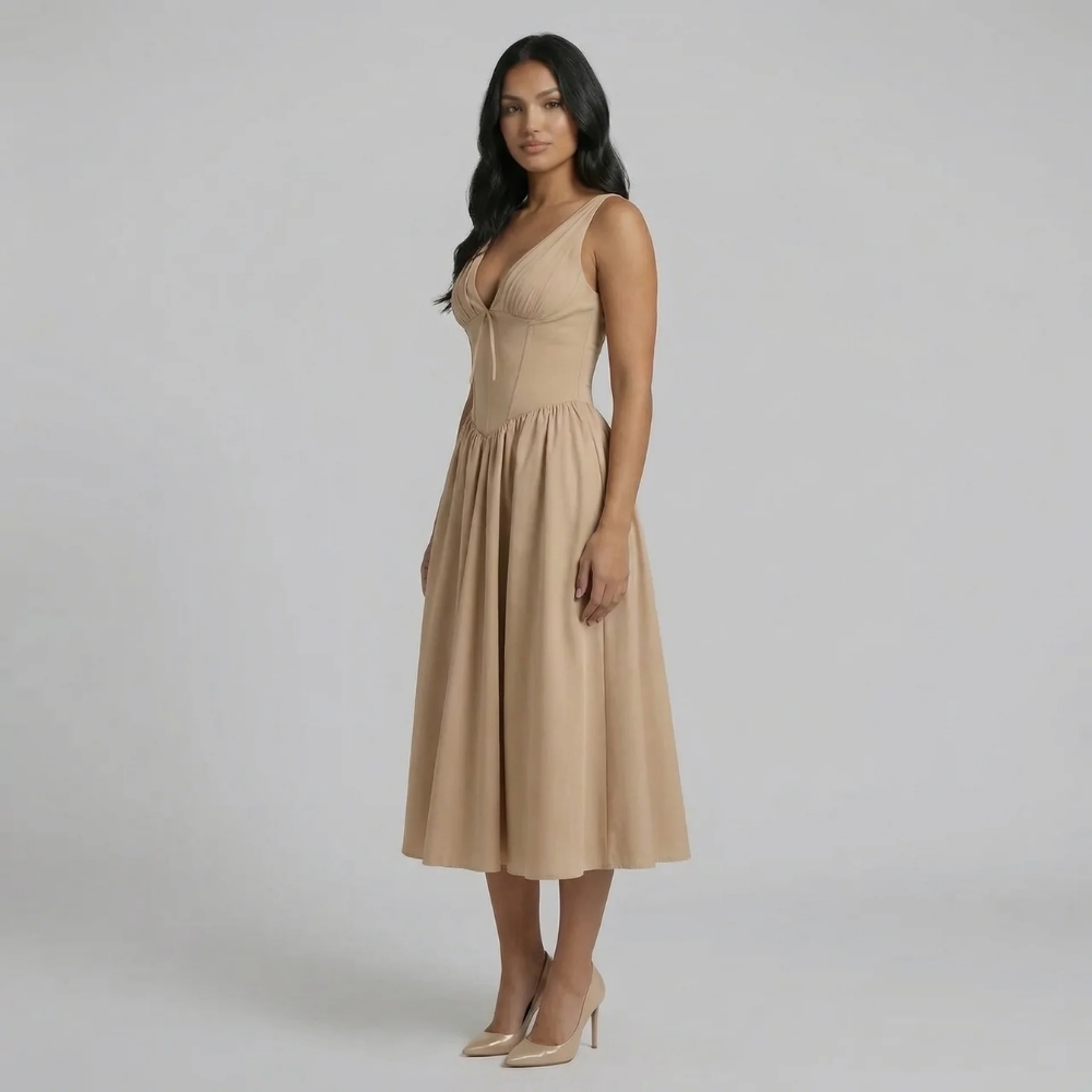 Beige A-line midi dress with tie neckline — side profile featuring flowing skirt.