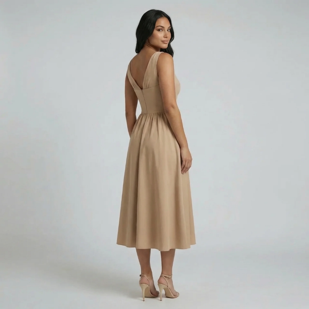 Beige A-line midi dress with deep V neckline — back view with elegant drape.