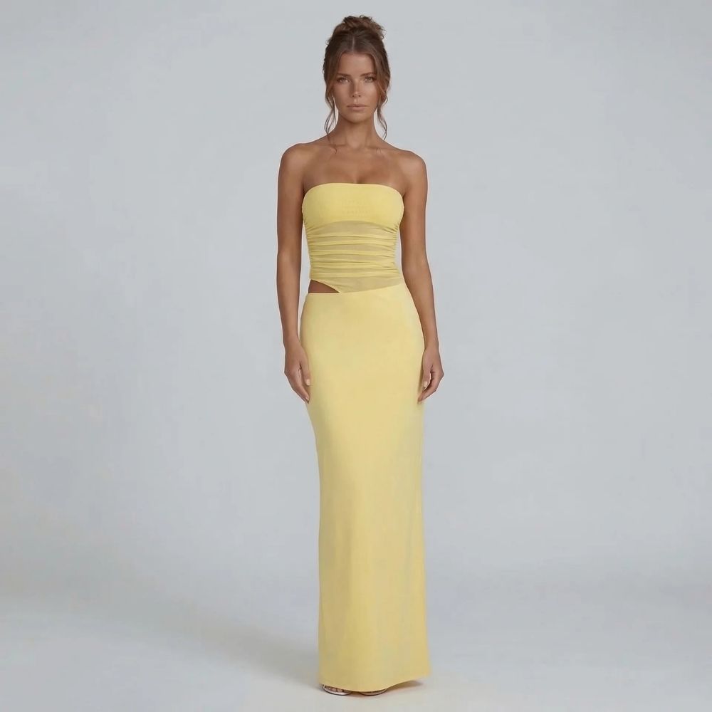 Yellow strapless ruched maxi dress with side cutout — front view showing fitted bodice and flowing skirt.