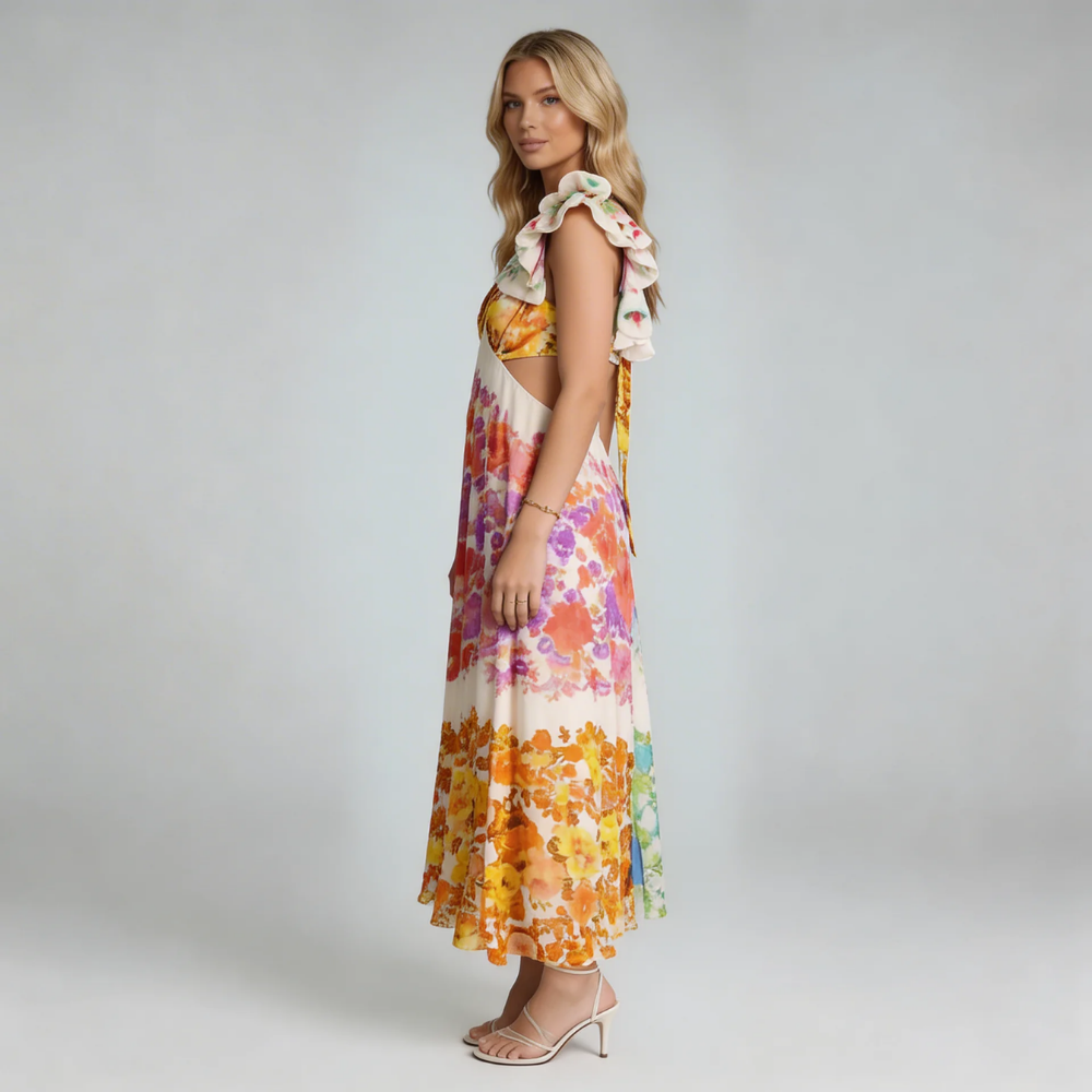 Multicolor floral maxi dress with ruffled shoulders and bow-tied back, front view on model.