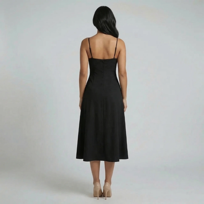 Black corset-style midi dress — back view highlighting zipper closure and adjustable straps.