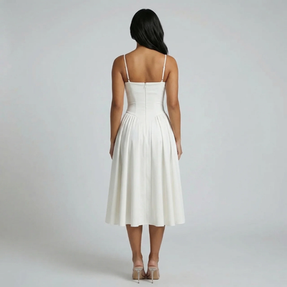 White corset-style midi dress — back view focusing on tailored fit and flowing skirt.