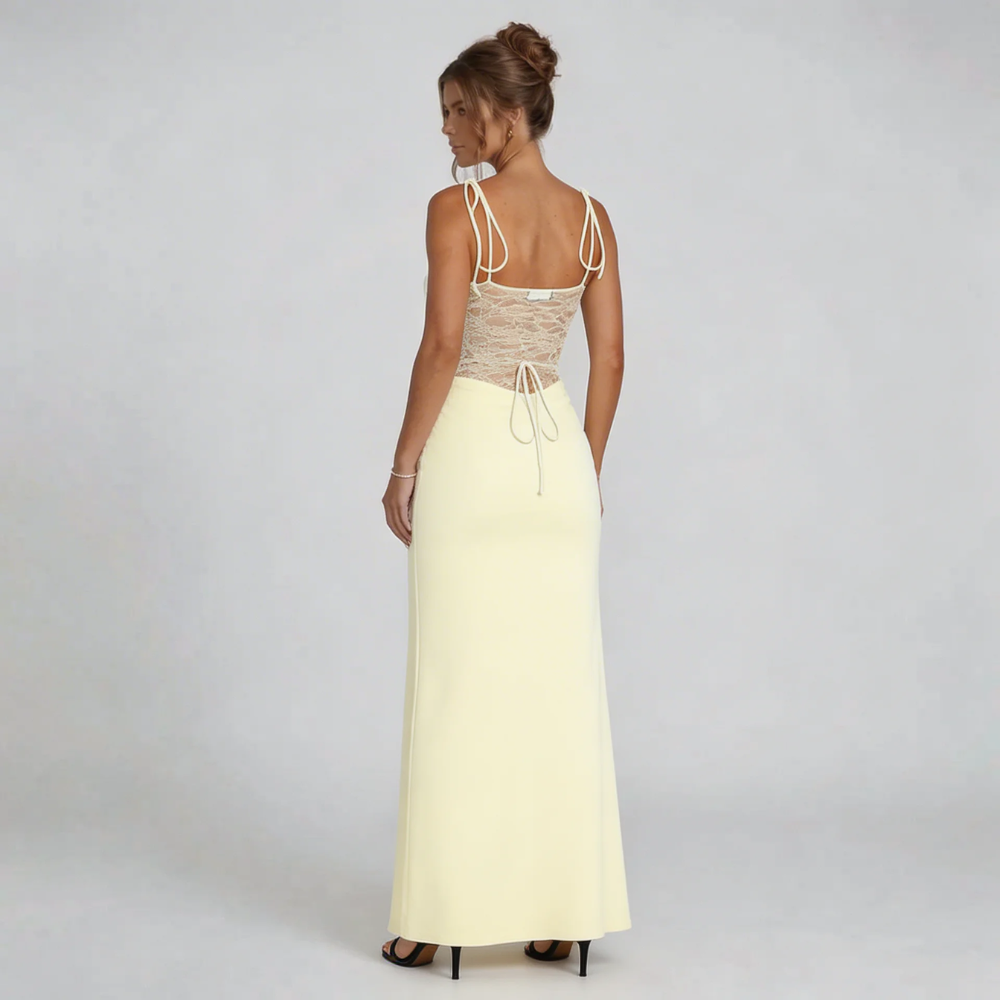 Cream maxi dress with corset back detail and flowing skirt — back view