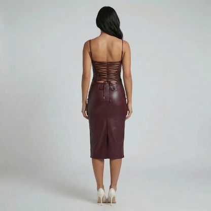 Burgundy vegan leather midi dress — back view detailing lace-up corset design and back slit.
